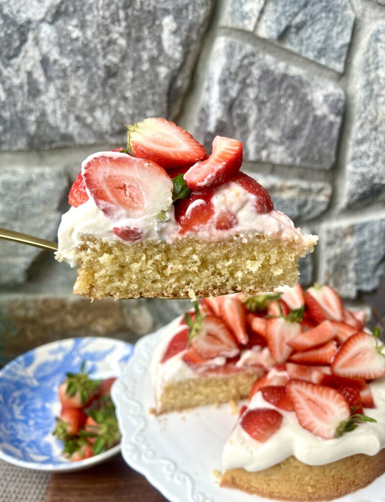 a slice of strawberry shortcake with whipped cream