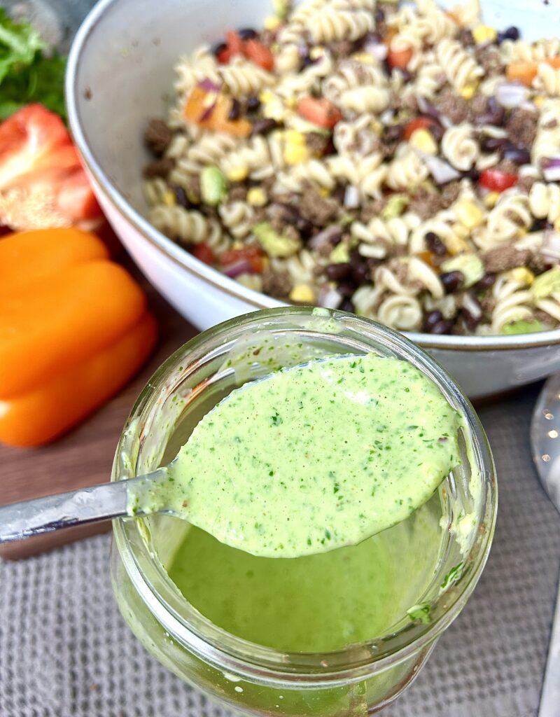 a jar of green cilantro lime salad dressing