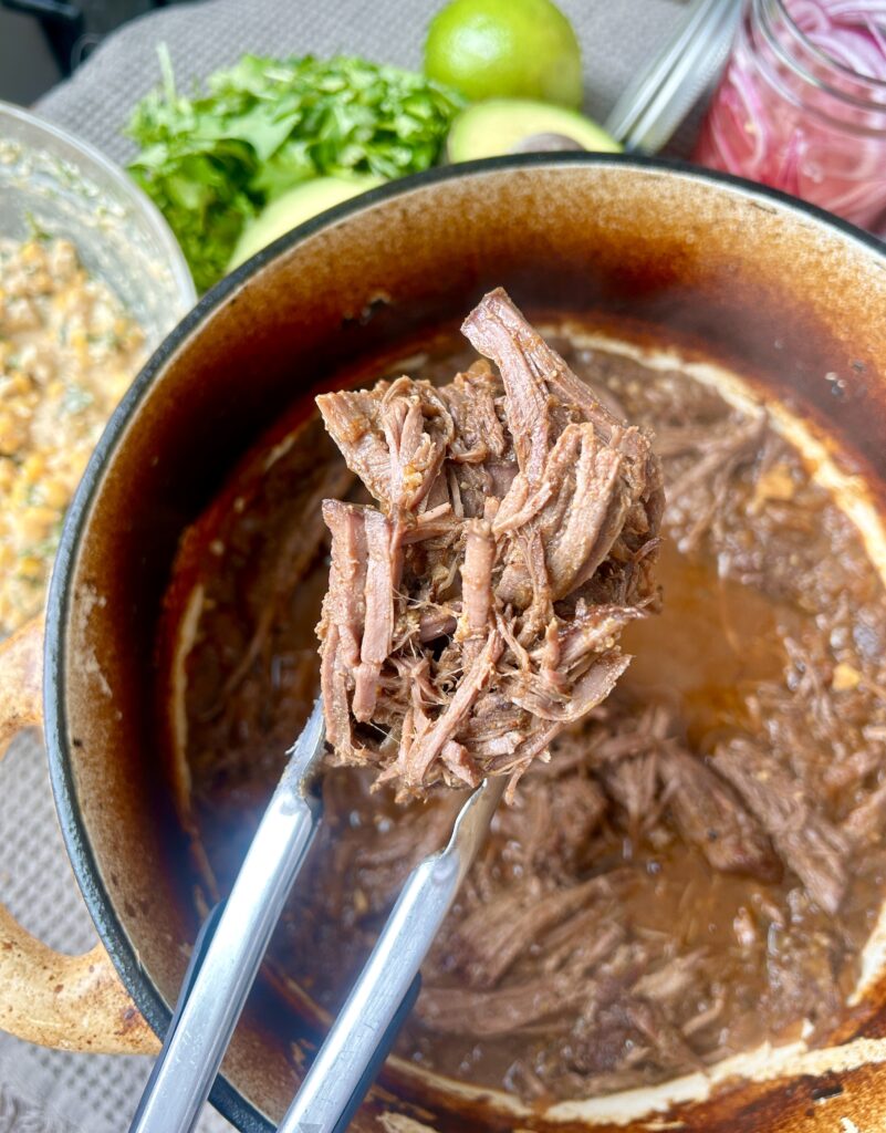 a pot of shredded venison meat