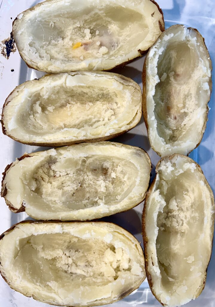a baking dish of potato skins