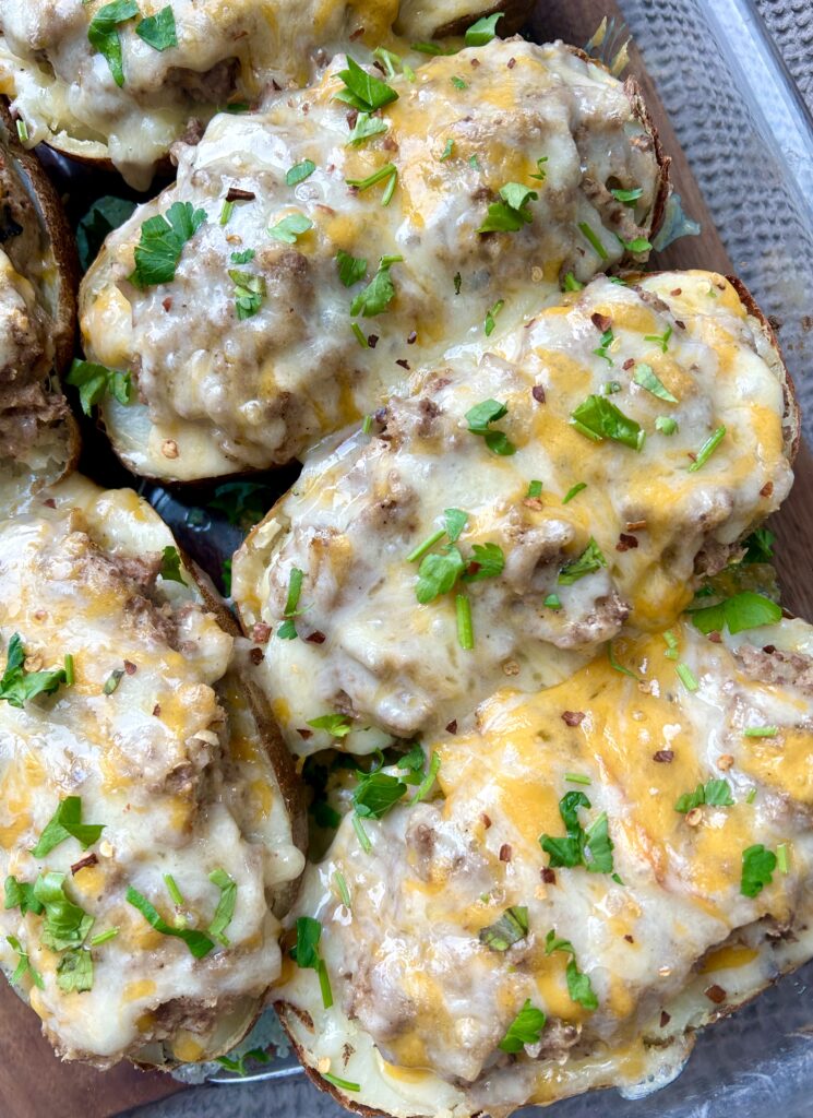 a baking dish of cheesy stuffed potatoes