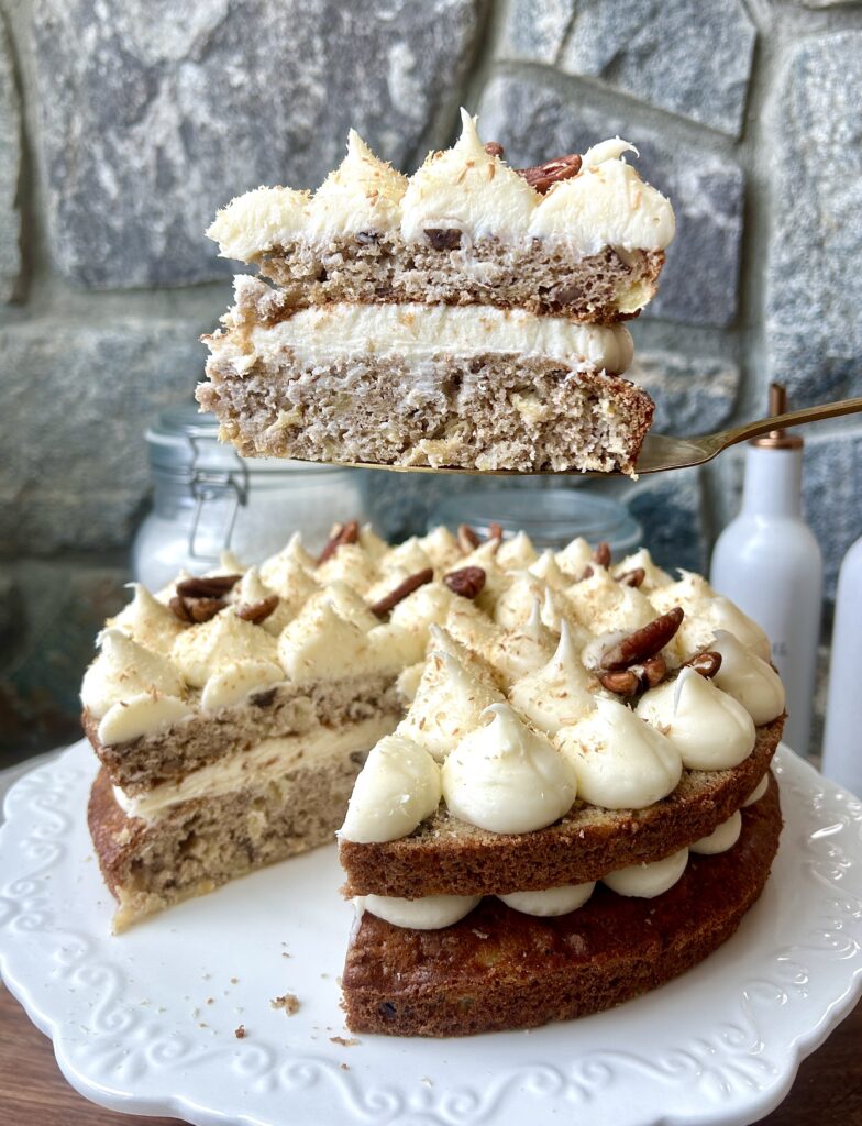 a slice of pineapple and banana cake with cream cheese icing