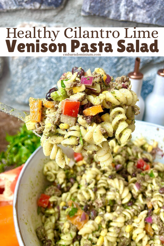 a spoonful of pasta salad with peppers, black beans, and corn