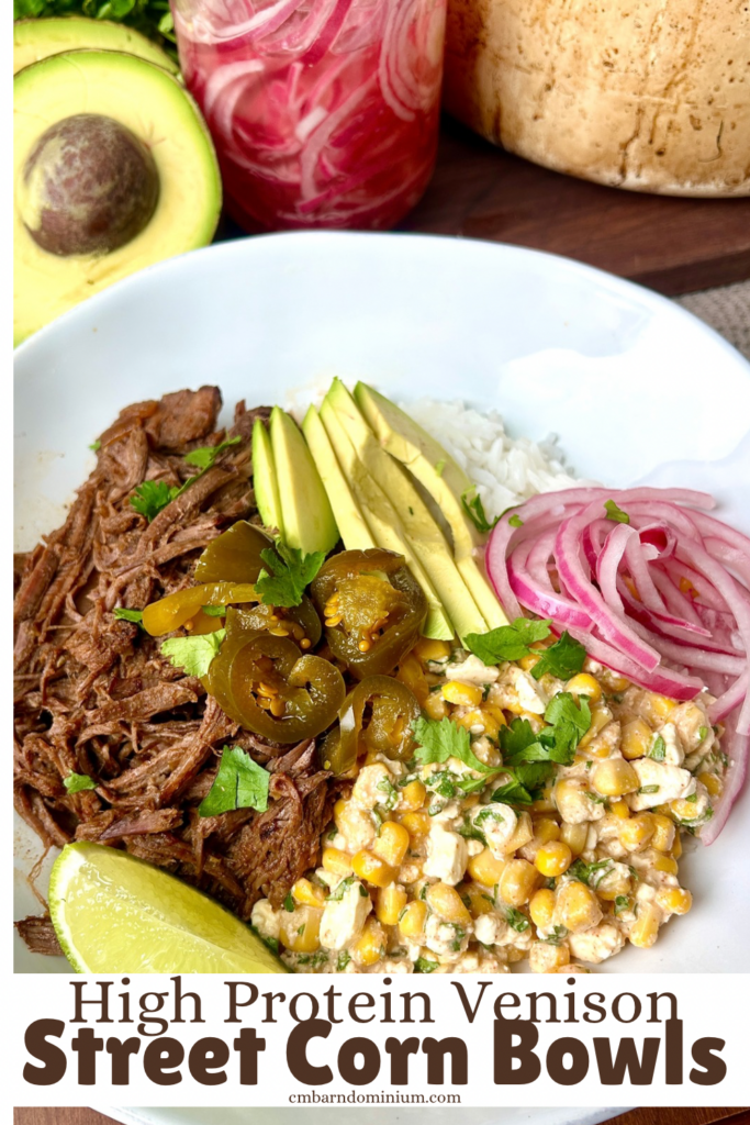 a white bowl of rice with shredded meat, corn, avocado and red onion