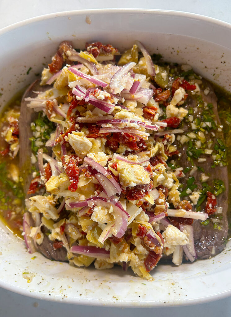 a marinated roast, topped with a greek vegetable filling