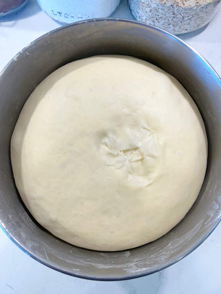 a bowl of proofed dough