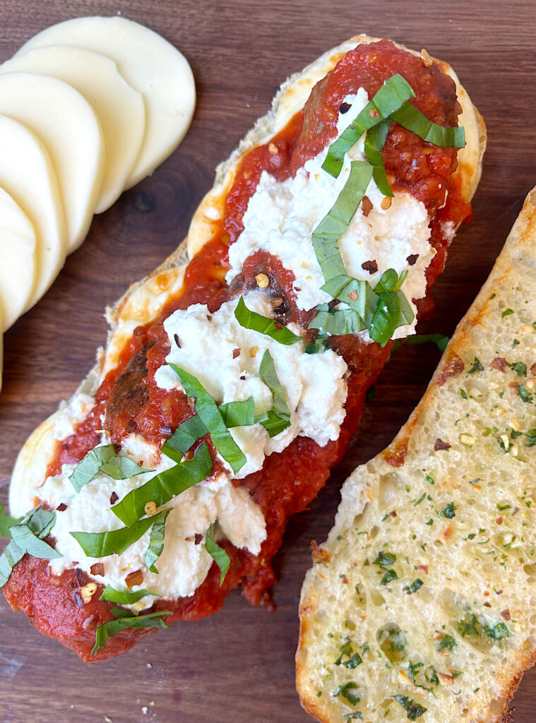 a meatball sub sandwich made with venison, marinara sauce and ricotta cheese