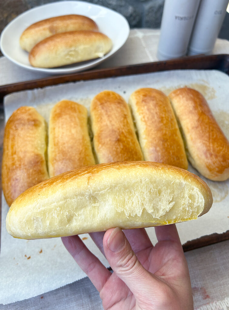 a fluffy golden sourdough hot dog bun