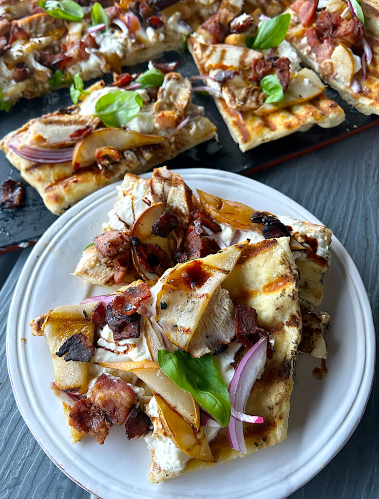 a white plate with sourdough flatbread on it