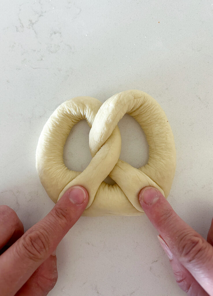 an unbaked sourdough soft pretzel