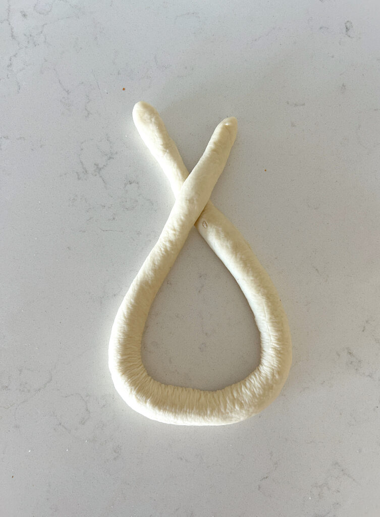soft pretzel dough being shaped