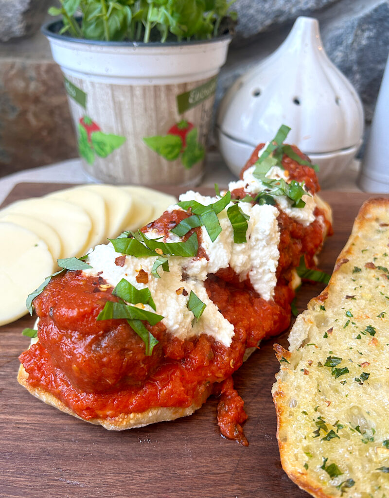 ciabatta bread, with venison meatballs, tomato sauce, basil and ricotta cheese