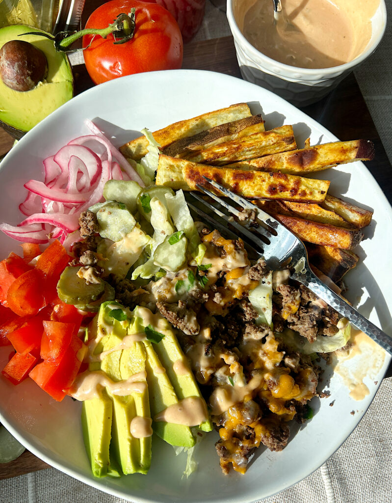 burger bowls with sweet potato fries, ground venison, pickles and avocado