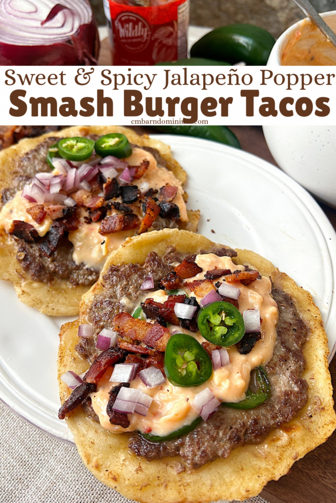a white plated with 2 tacos with jalapeños and bacon