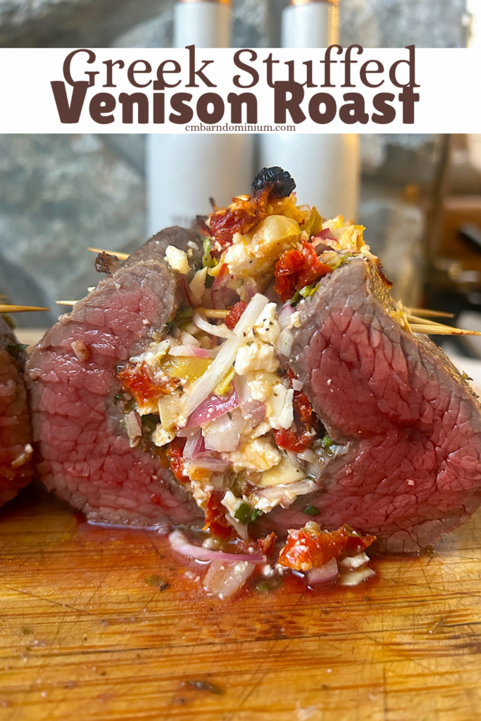 a meat roast stuffed with vegetables and feta cheese
