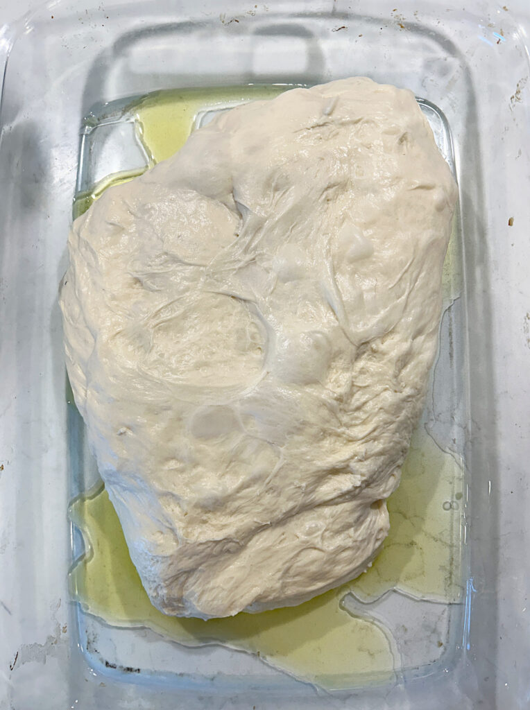 a baking dish with bread dough