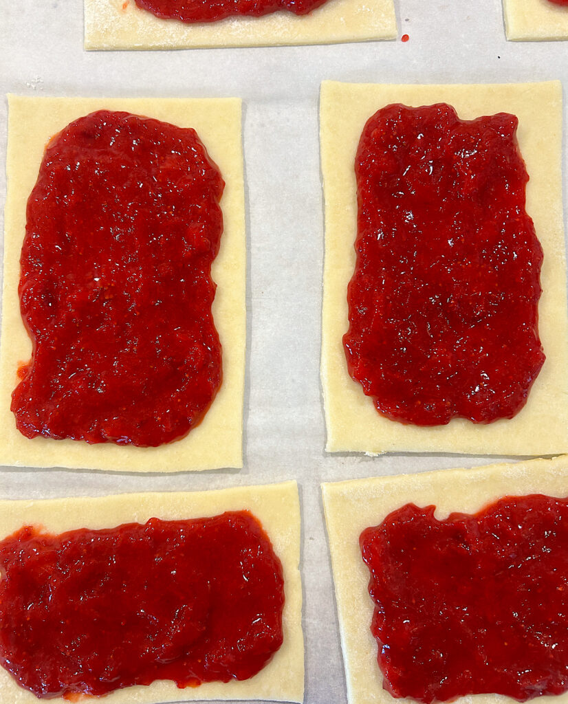 pastry dough, with strawberry rhubarb pie filling on top