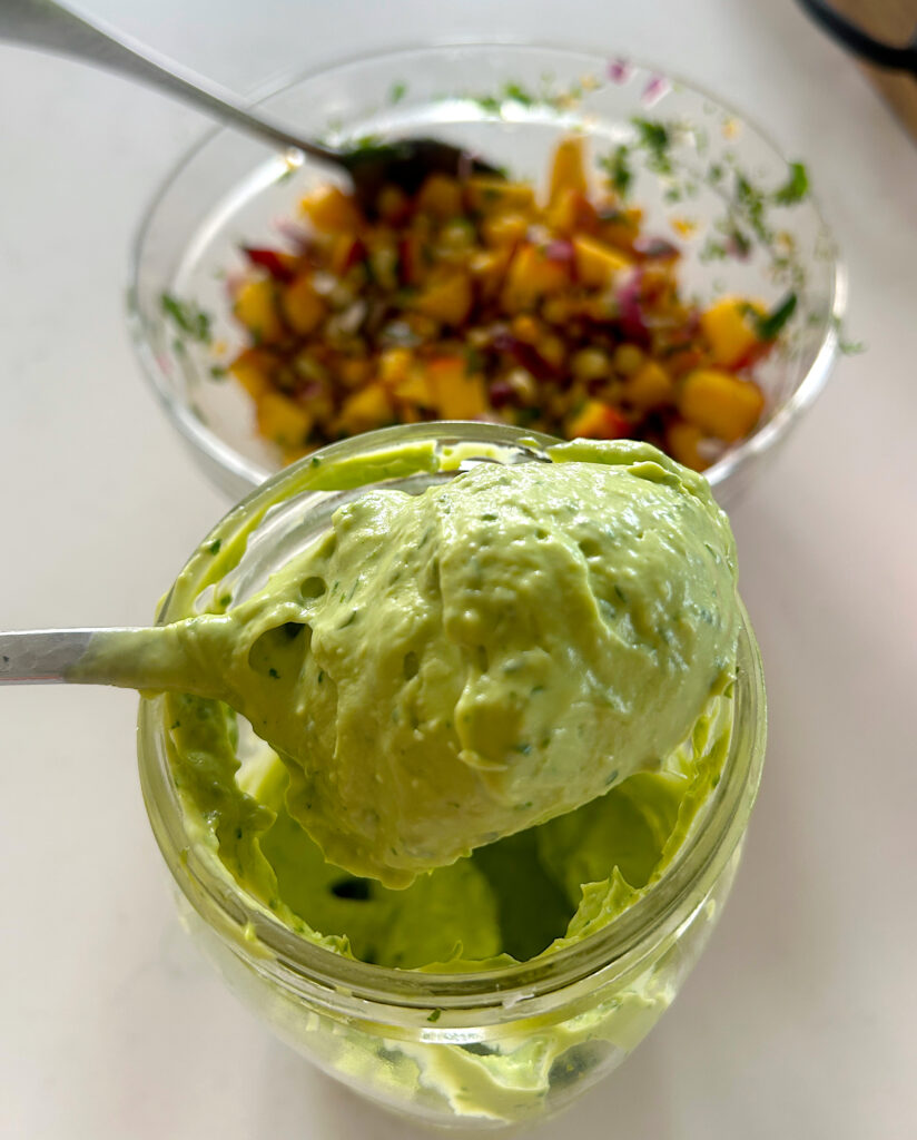 a jar of thick, creamy avocado sauce