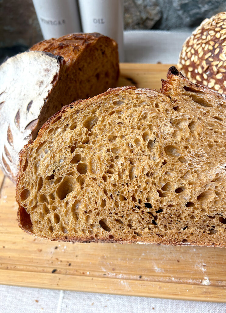 a loaf of molasses bread cut in half