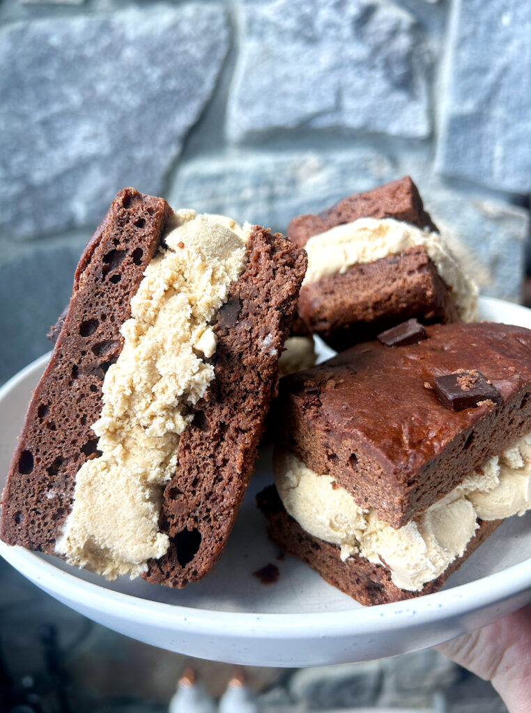 a plate of brownies ice cream sandwiches with coffee ice cream