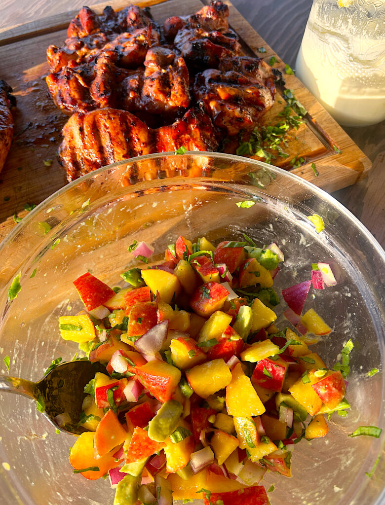 a bowl of peach and avocado salsa