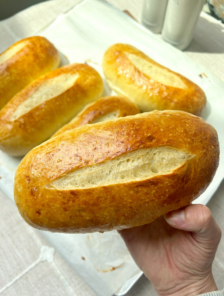 a soft and golden sourdough hoagie sandwich bun