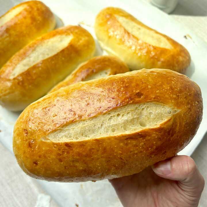 a soft and golden sourdough hoagie sandwich bun