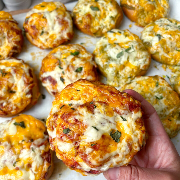 a sourdough soft pretzel topped with pizza sauce and cheese
