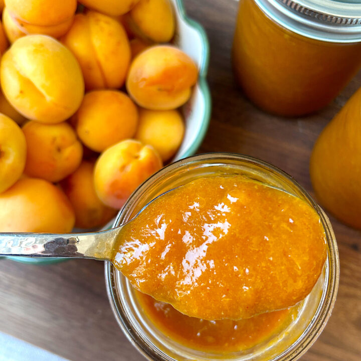 a jar full of orange apricot bbq sauce