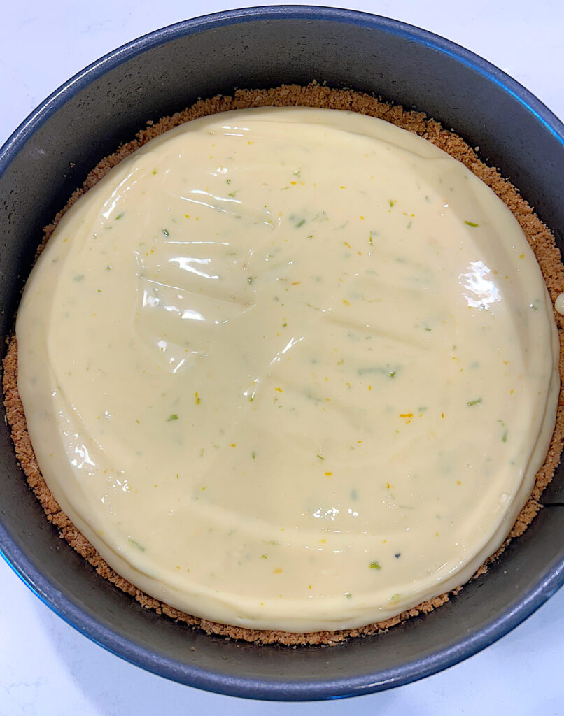 an unbaked key lime pie in a cake pan