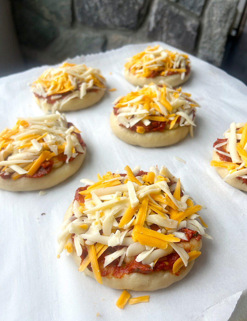 a tray of unbaked pizza pretzels