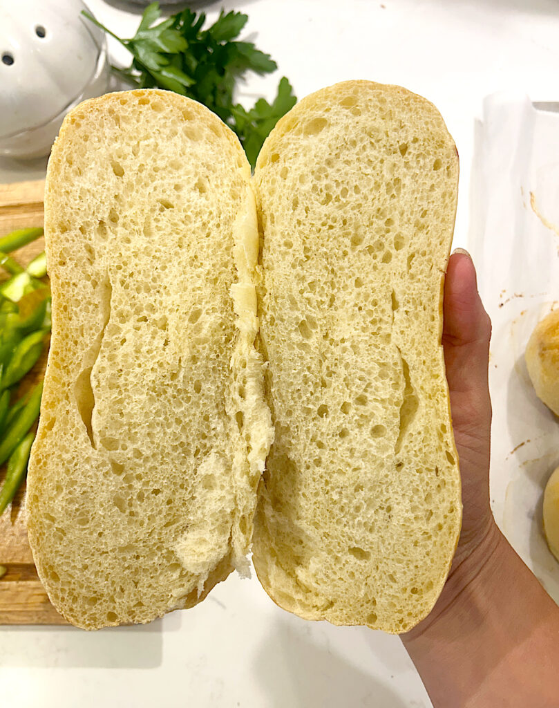 a soft hoagie sandwich roll cut in half