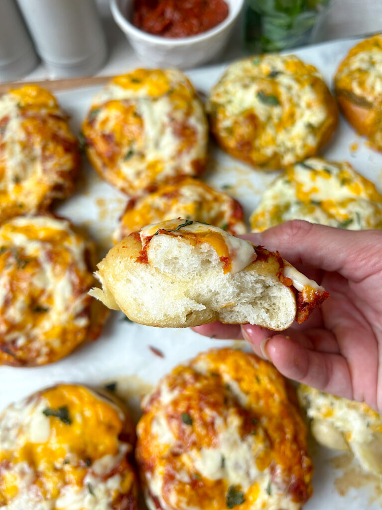 a soft sourdough pizza pretzel ripped in half