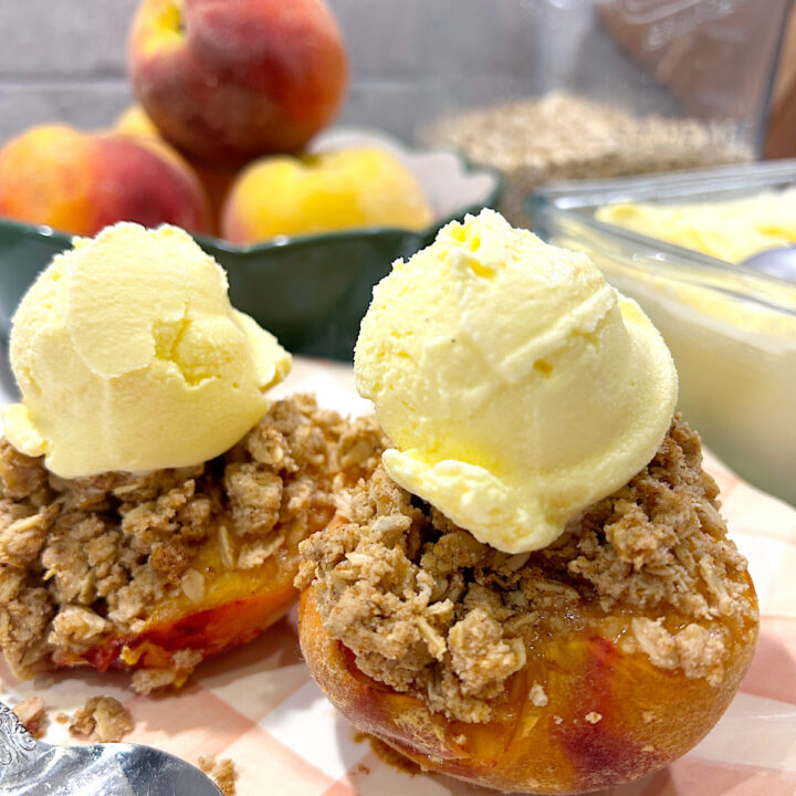 peaches with crumble topping and vanilla ice cream on top