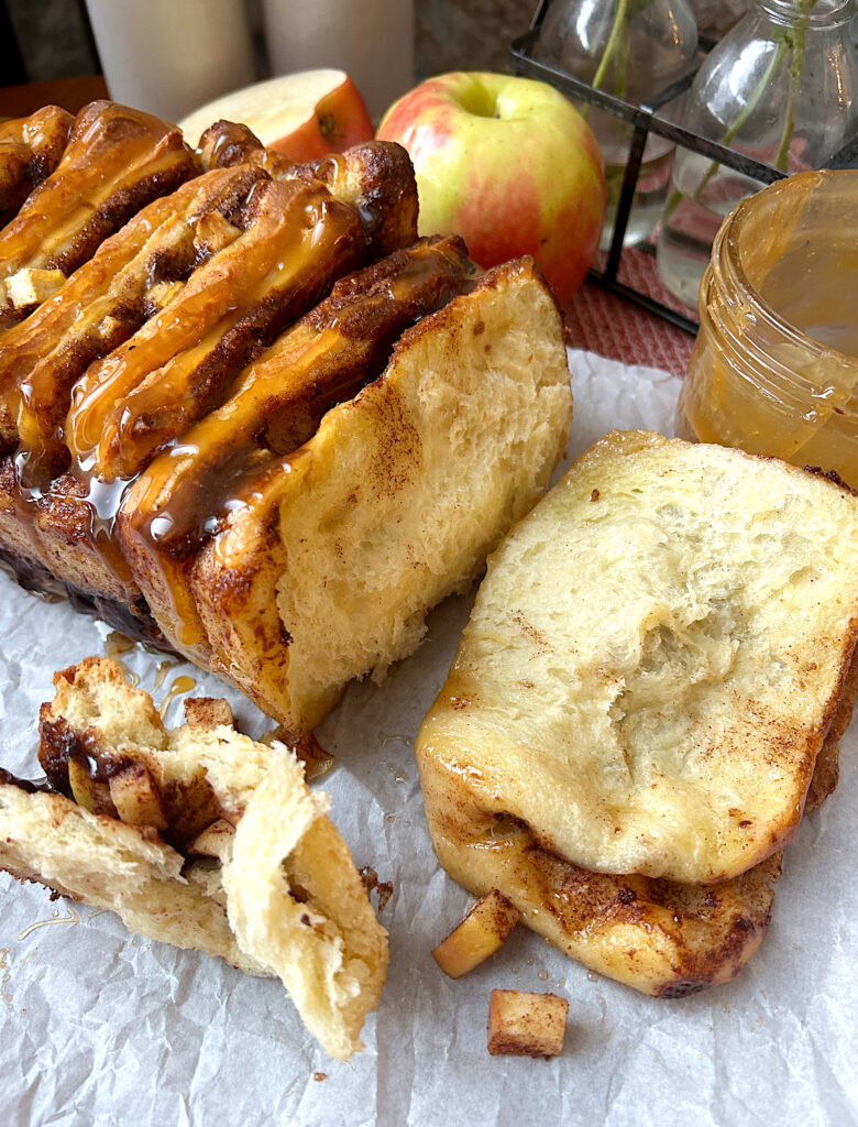 a loaf of pull apart sourdough bread on parchment