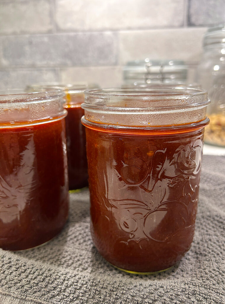 a pint jar full of of homemade bbq sauce 