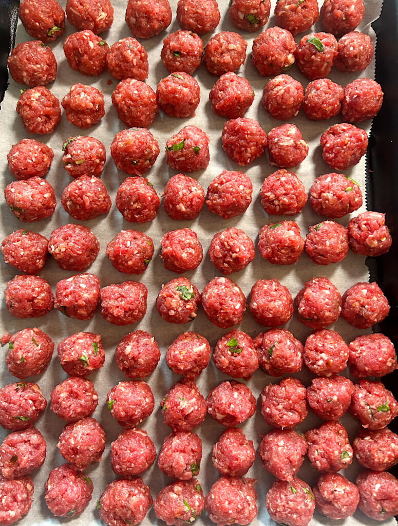 a tray of mini italian venison meatballs uncooked