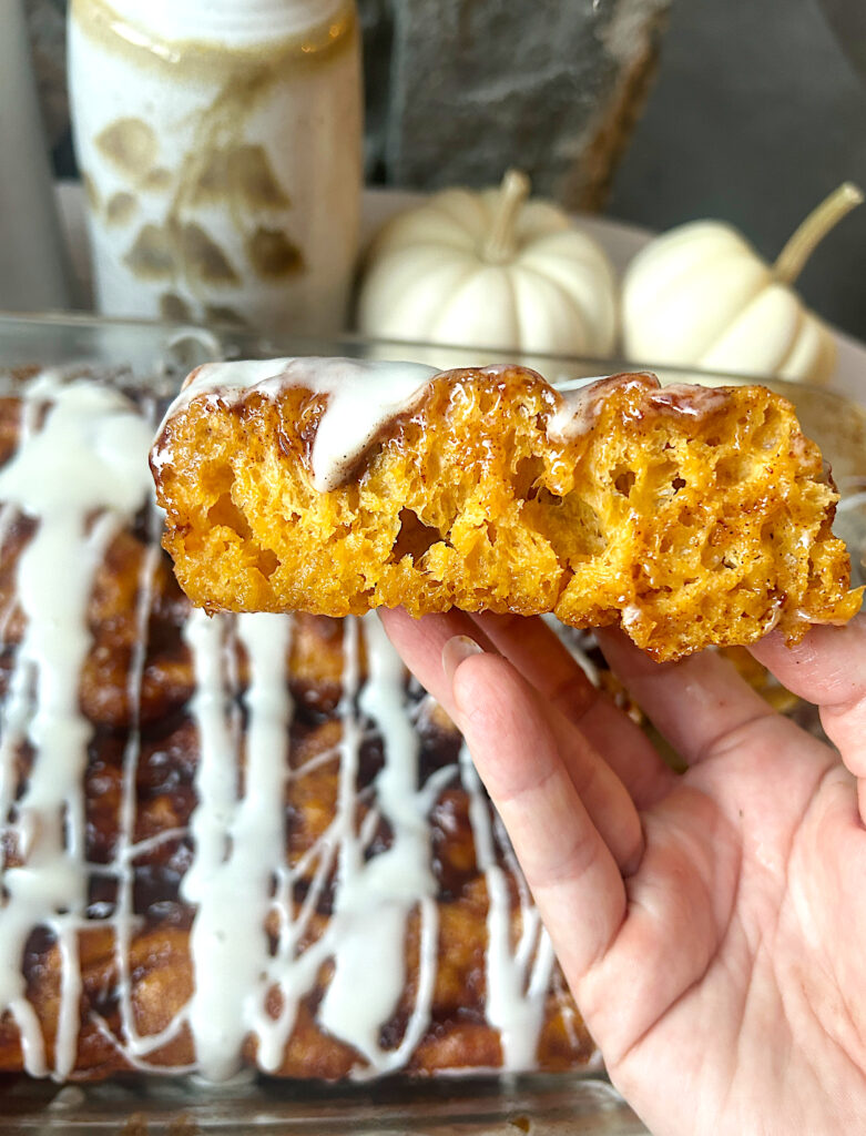 a slices of pumpkin focaccia bread with cream cheese glaze