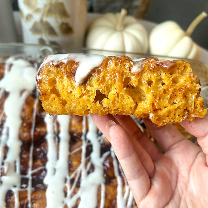 a slices of pumpkin focaccia bread with cream cheese glaze